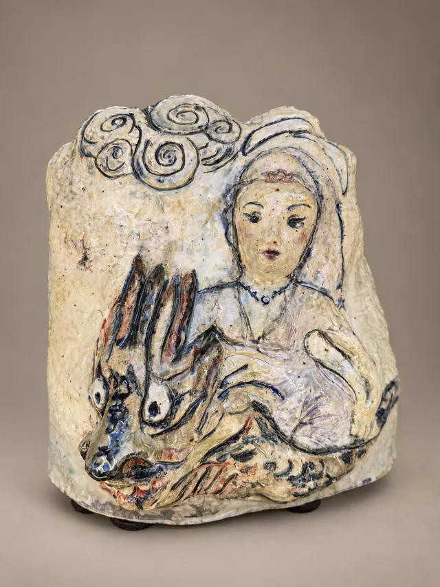Ceramic stone with a veiled woman and a rabbit, inscribed on the back