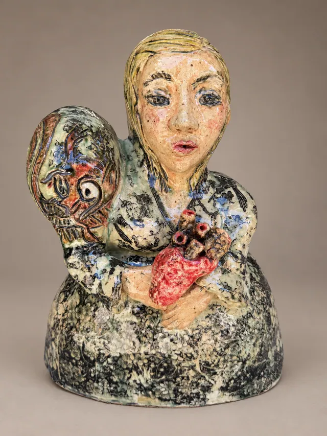 Bust of a woman holding a red heart, with a fish at her shoulder