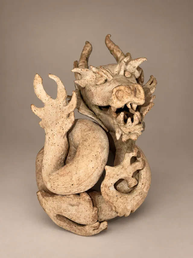 Unglazed dragon sculpture