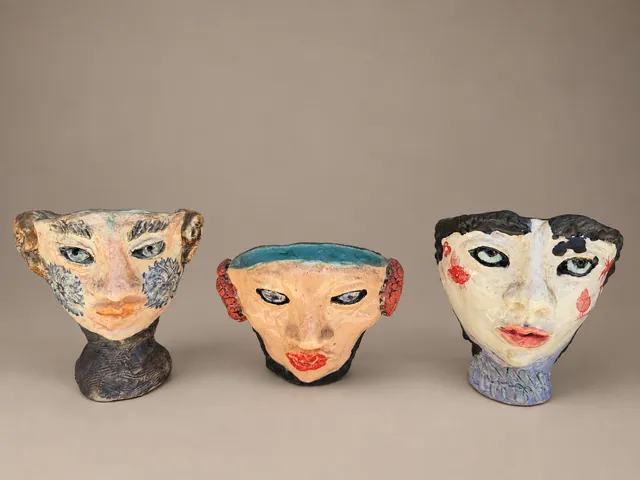 Three small face cups