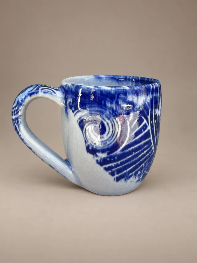 Cobalt and white mug with a spiral design